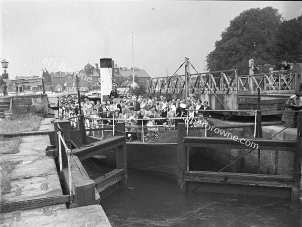 FERRY, FULL OF PASSENGERS AT LOCK